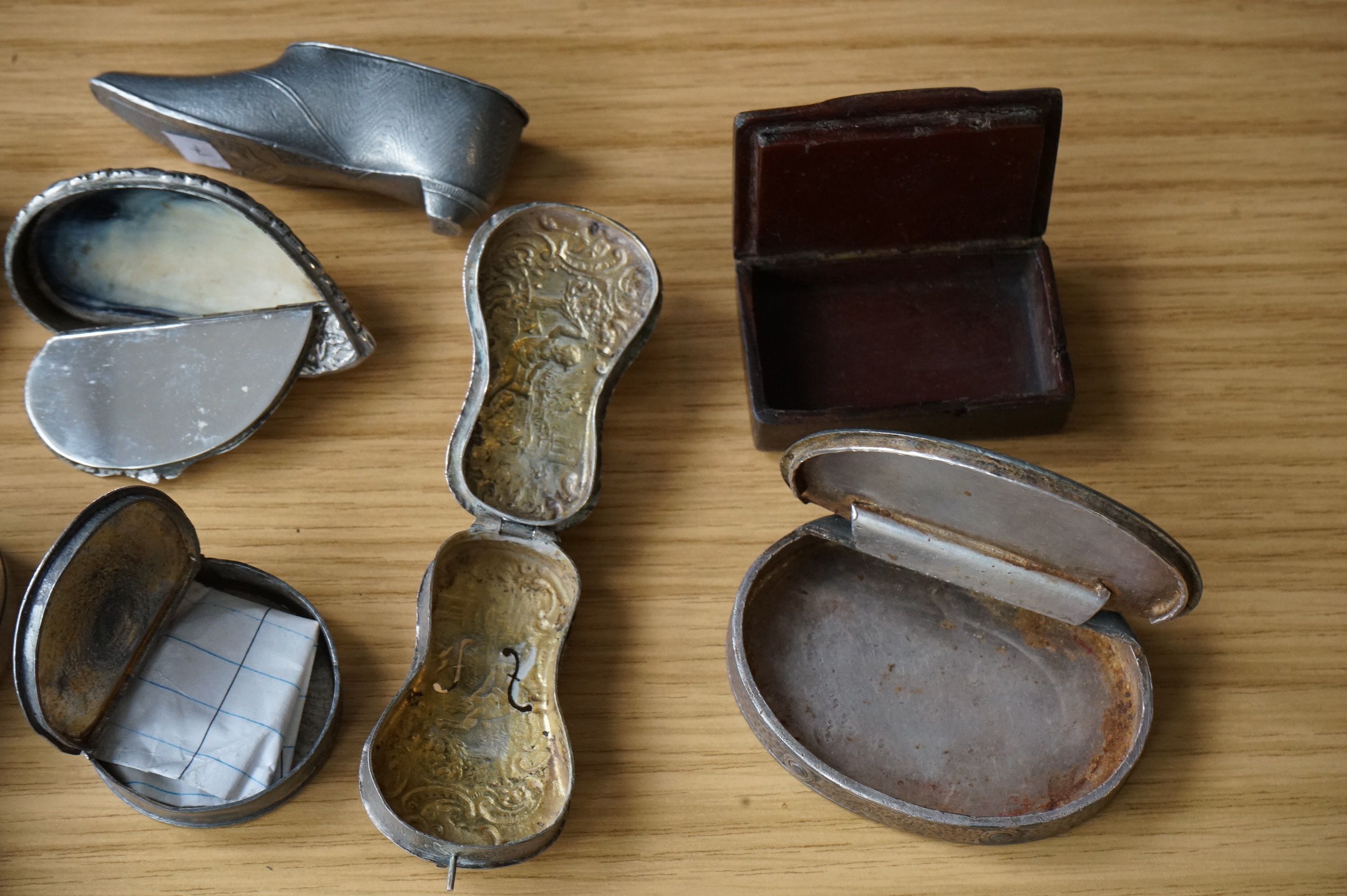 A collection of mixed metal stuff boxes including a novelty cello shaped box being 12cm long